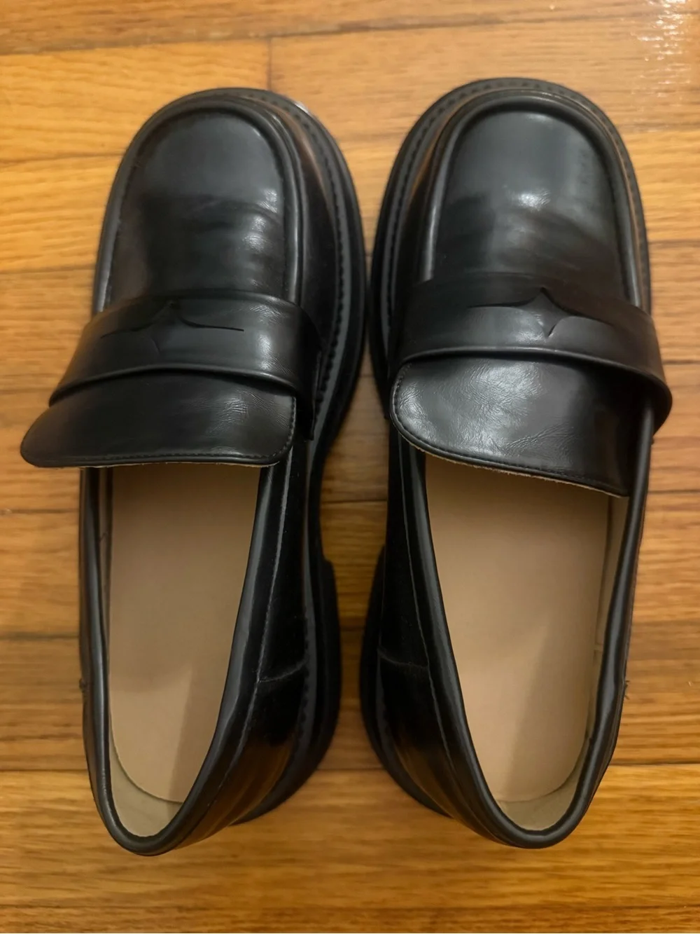 Black faux leather loafers with chunk sole
